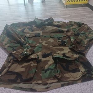 A camouflage jacket size medium Button Up Front Four Pockets All Button In The F